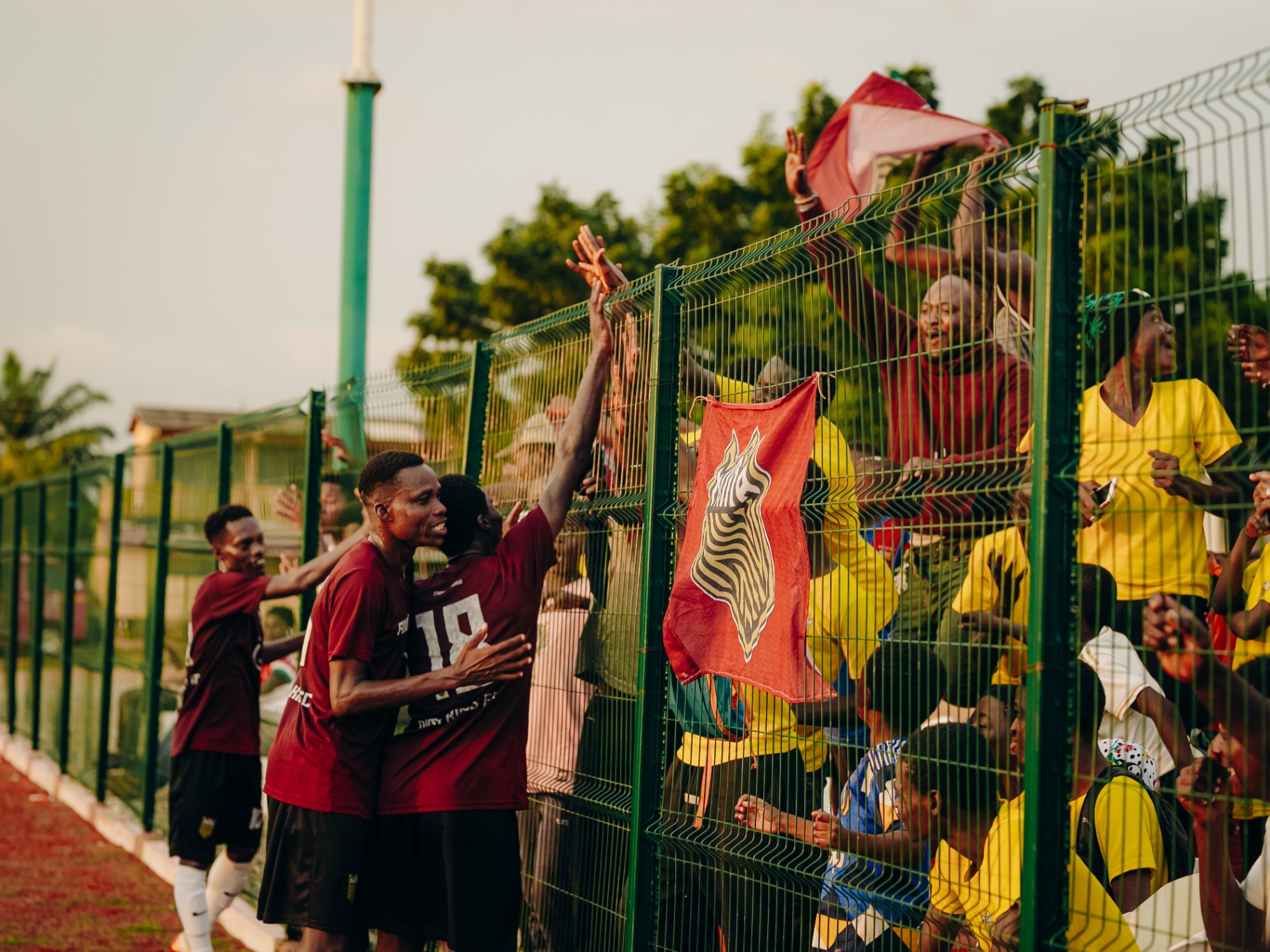 Nima Kings FC players celebrating a win in front of supporters